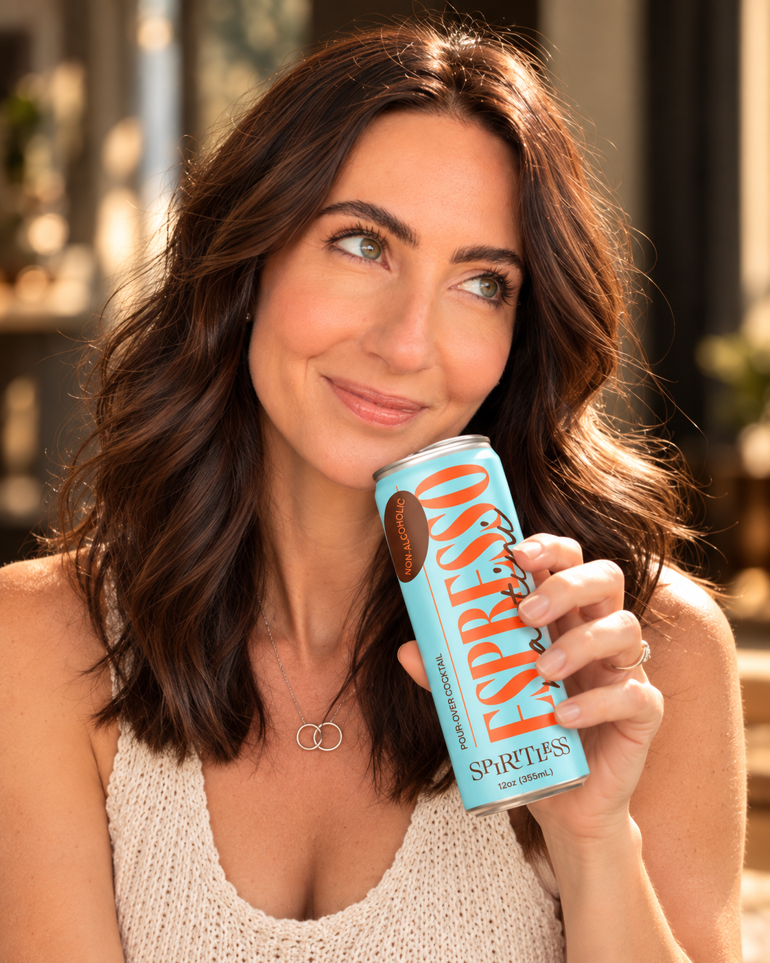 Spiritless Co-Founder and CEO Lexie Lancaster Larsen with a can of Spiritless Espresso Martini